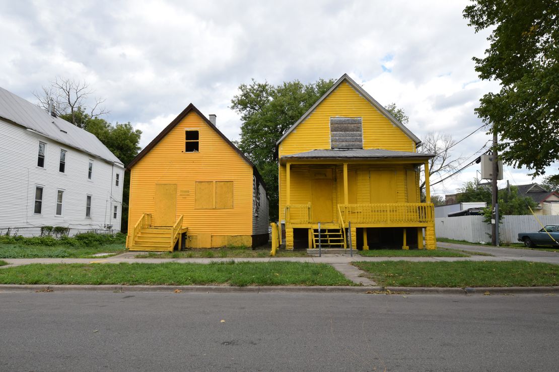 The empty homes became sculptural, with a familiar color palette taken from products and services marketed to Black residents, that also spoke to systemic inequities.