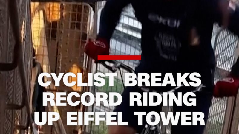 Cyclist breaks record riding up Eiffel Tower