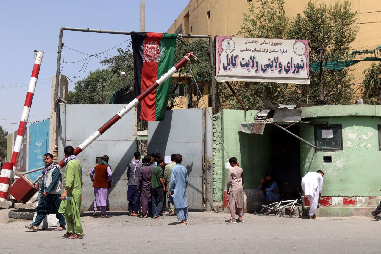 Afghans who work at different offices rush to homes in Kabul, Afghanistan, after news broke that the Taliban reached the outskirts of Kabul on August 15, 2021.