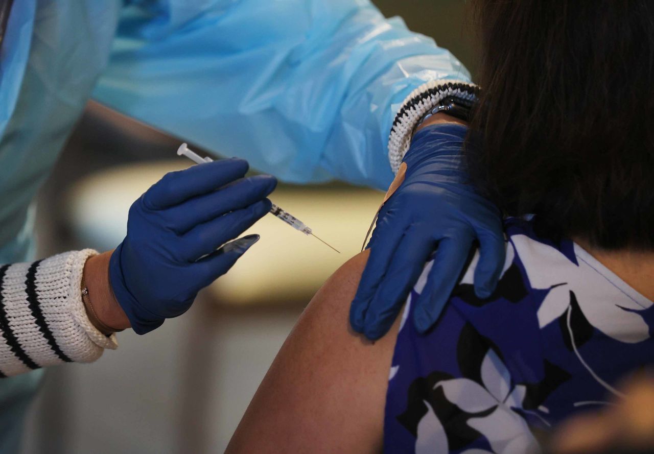 A healthcare worker administers a Pfizer-BioNtech COVID-19 vaccine at the John Knox Village Continuing Care Retirement Community in Pompano Beach, Florida, on January 6. 