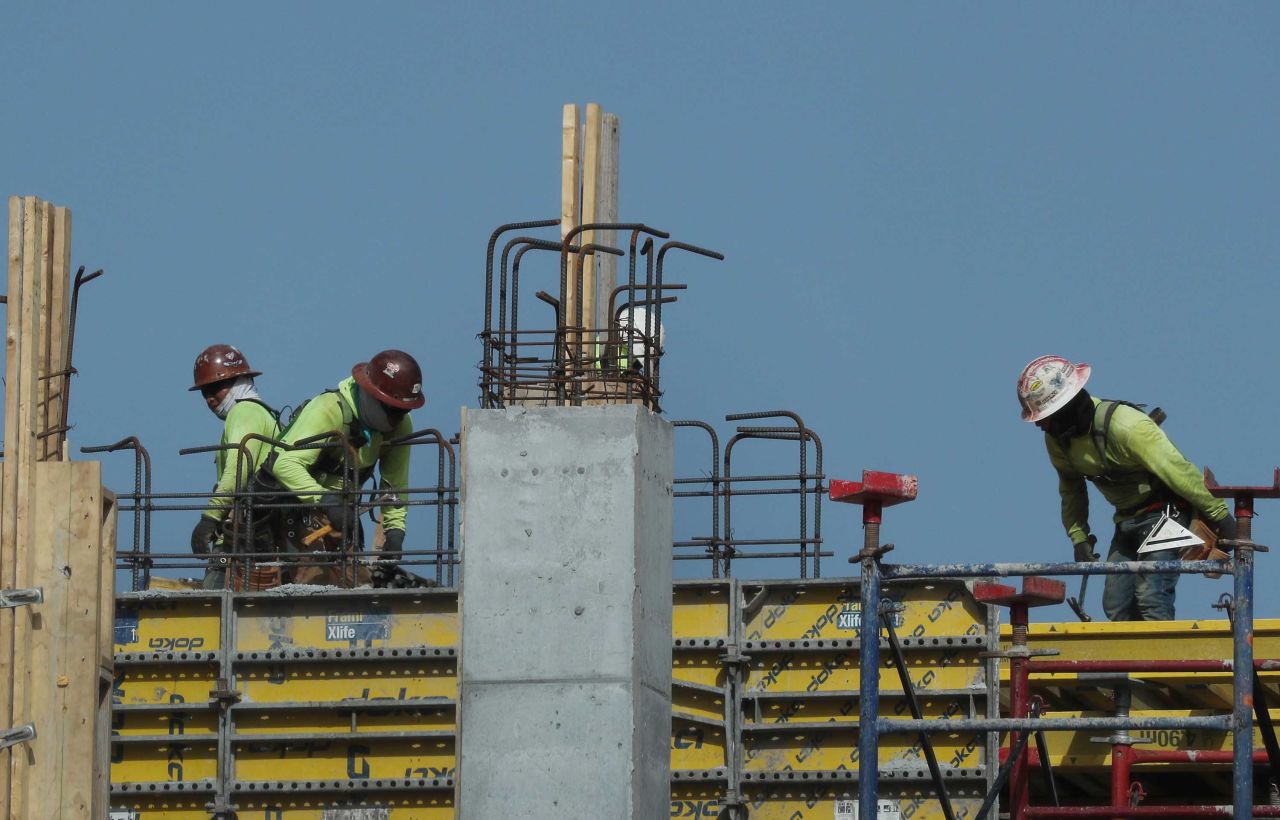  Construction workers are seen on a job site in Miami, Florida on September 4.