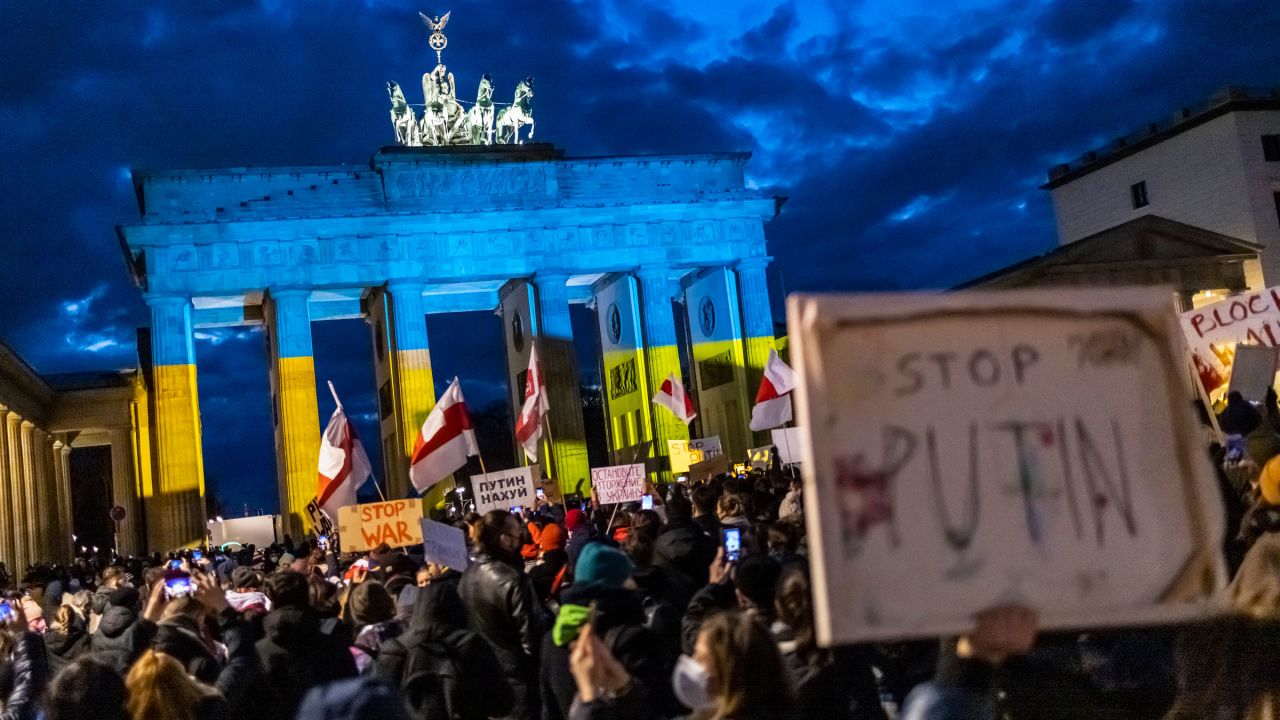 People protest in front of the Brandenburg Gate in Berlin on Thursday.
