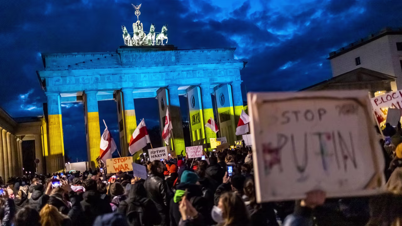 People protest in front of the Brandenburg Gate in Berlin on Thursday.