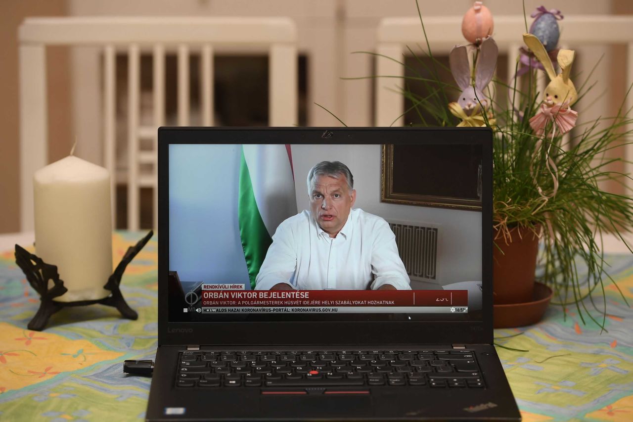 Hungarian Prime Minister Viktor Orban is pictured on a laptop in a flat in Budapest, as he makes an announcement on April 9.