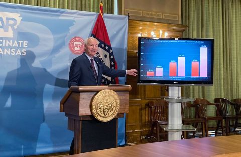 Arkansas Gov. Asa Hutchinson stands next to a chart displaying Covid-19 hospitalization data as he speaks at a news conference at the state Capitol in Little Rock, Arkansas, on July 29.