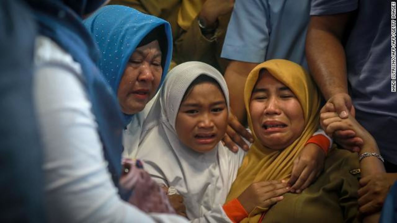 Relatives of victims gather at the Pangkal Pinang airport on the island of Bangka on Monday. (Photo by Hadi Sutrisno/AFP/Getty Images)