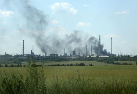 Smoke billows over the oil refinery outside Lysychansk on June 21.