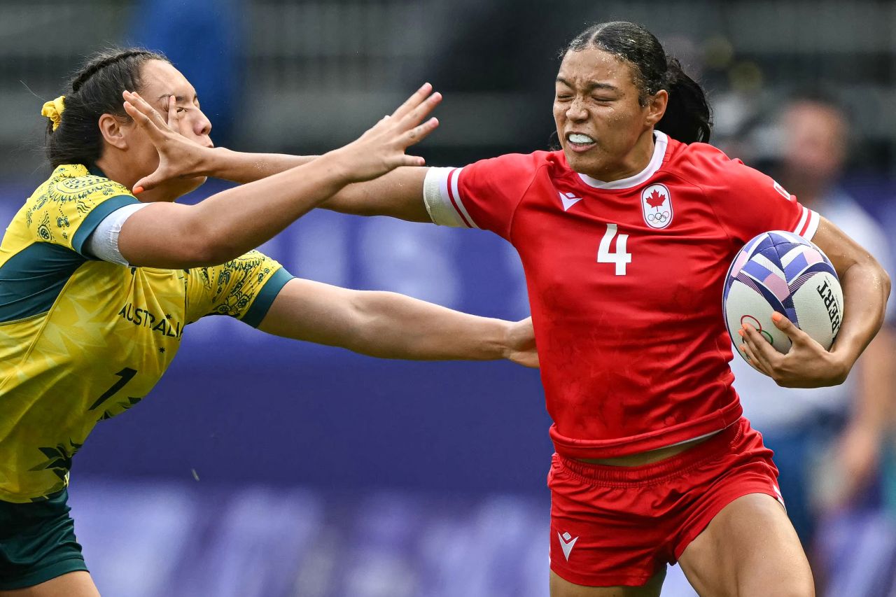 Canada's Asia Hogan-Rochester is tackled by Australia's Bienne Terita on Tuesday.