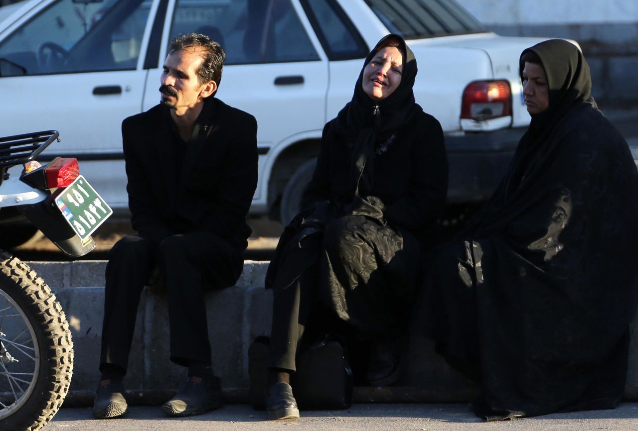 Relatives of stampede victims wait outside Bahonar hospital in Kerman. Credit: Attar Kenare/AFP via Getty Images)