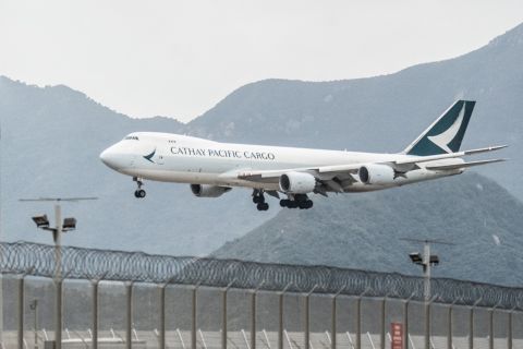 A Cathay Pacific cargo airplane prepares to land at Hong Kong International Airport on November 21, 2021. 