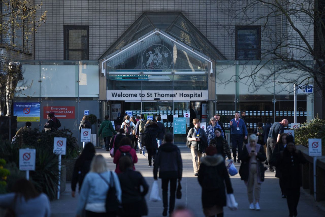 People arrive at St Thomas' hospital in central London where Britain's Prime Minister Boris Johnson is in intensive care on April 7.