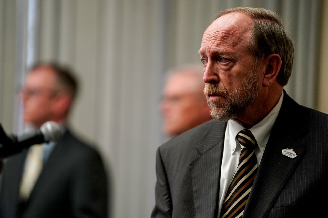 Colorado Springs Mayor John Suthers stands during a news conference, on May 11, 2021.