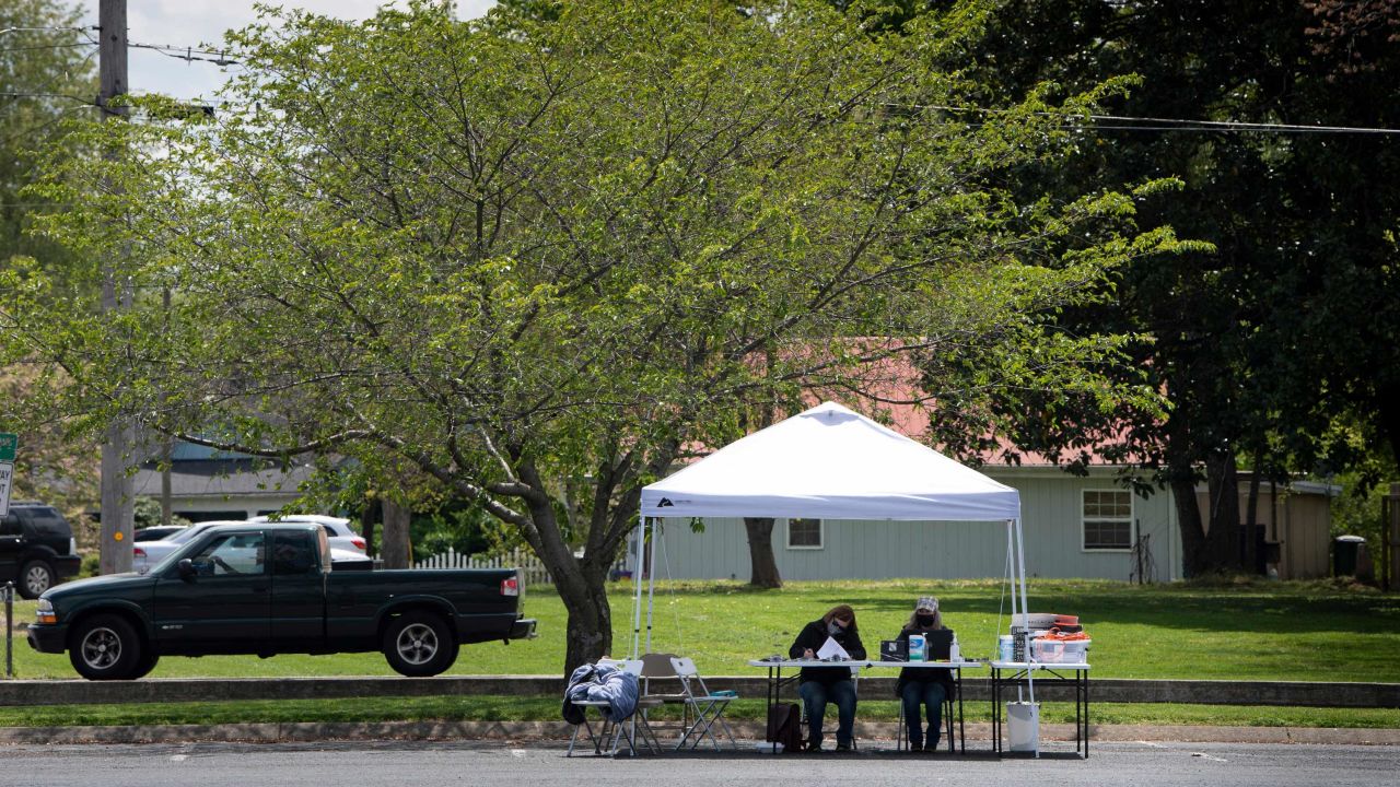 Kelly Mooneyham and Karen Willmore of Adhere Rx wait for COVID-19 vaccine recipients at a pop-up vaccination clinic in Portland, Tennessee, on April 22. 