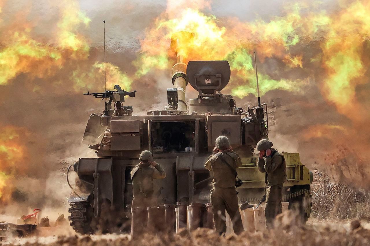 An Israeli army self-propelled howitzer fires rounds near the border with Gaza in southern Israel, on Wednesday, October 11.