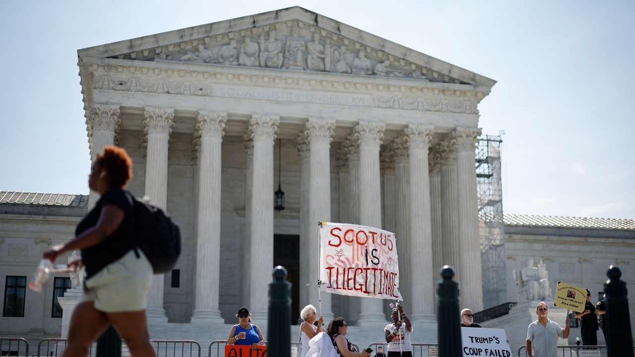  Demonstrators rally in front of the U.S. Supreme Court on June 28 in Washington, DC. 