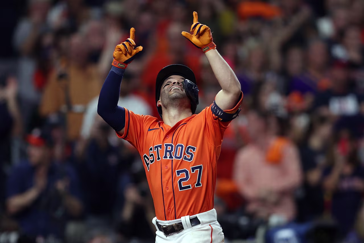 Jose Altuve of the Houston Astros celebrates after hitting a one run home run against the Atlanta Braves during the seventh inning.