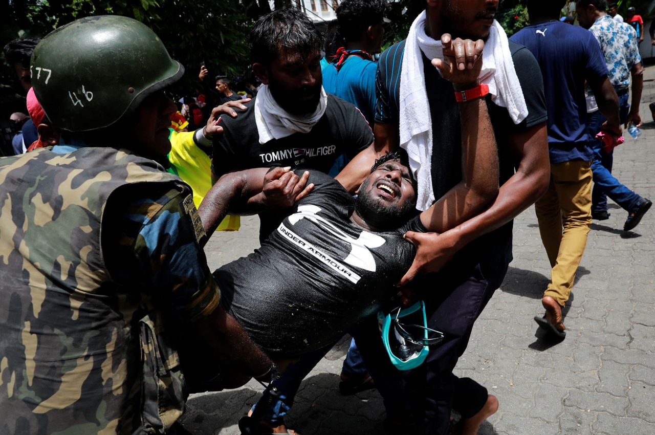 People carry an injured protester during a protest outside?Sri?Lanka's Prime Minister Ranil Wickremesinghe's office in Colombo,?Sri?Lanka, on?July 13.