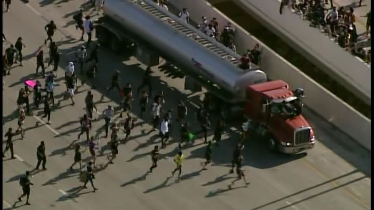 Minneapolis protesters converge on a truck driving on the freeway on May 31, 2020.