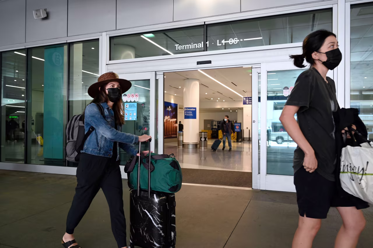 Travelers are seen at Los Angeles International Airport on Monday.