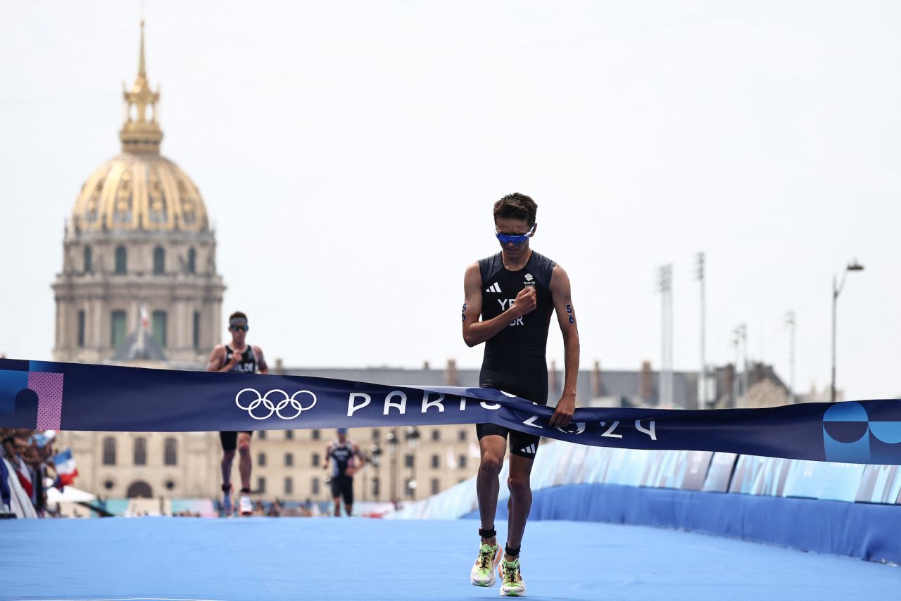 Britain's Alex Yee crosses the finish line to win the men's individual triathlon on Wednesday.