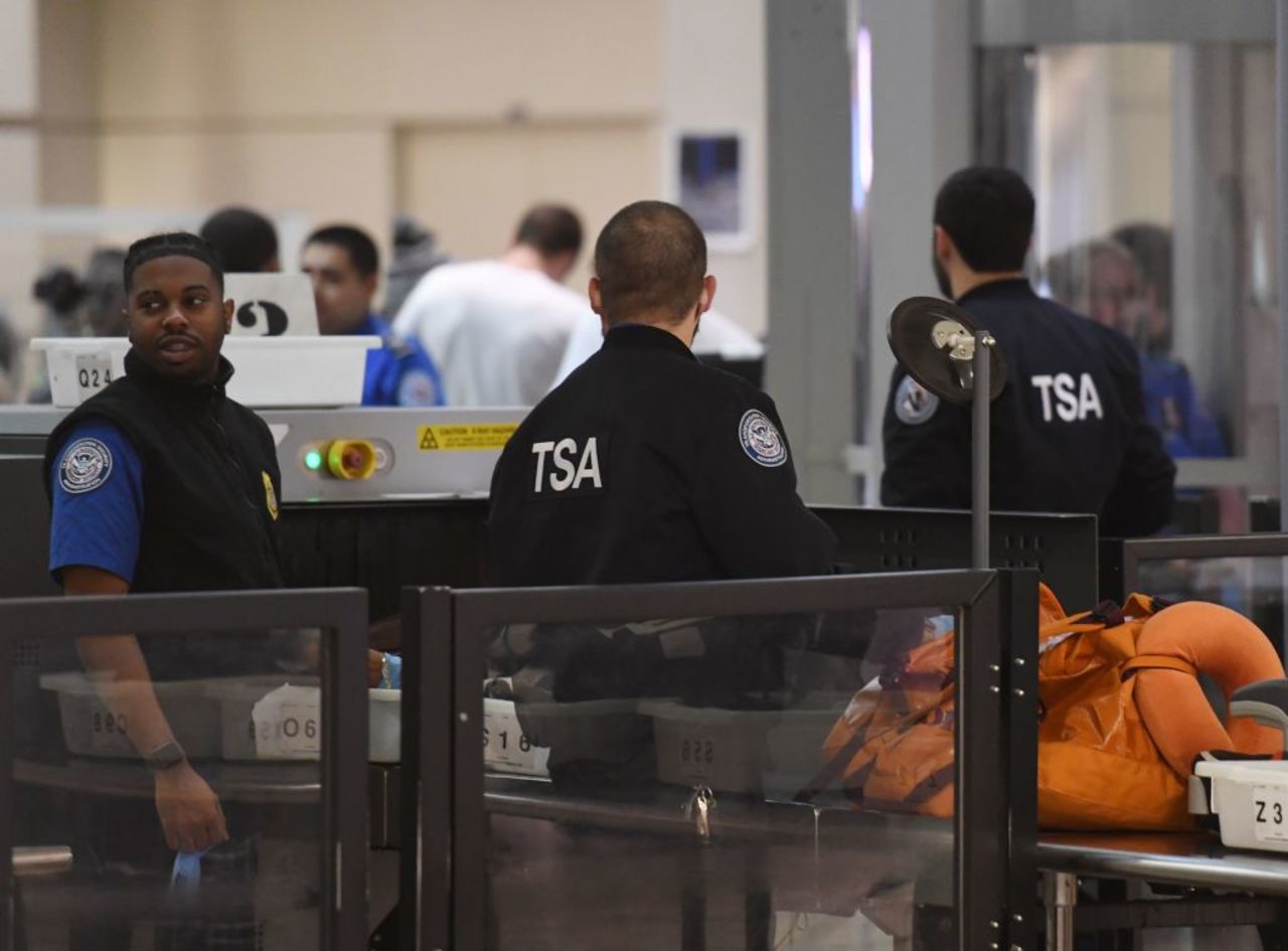 Transportation Security Administration officers screen passengers at the departure area of the Los Angeles International Airport in Los Angeles, California, on Jan. 5, 2019. 