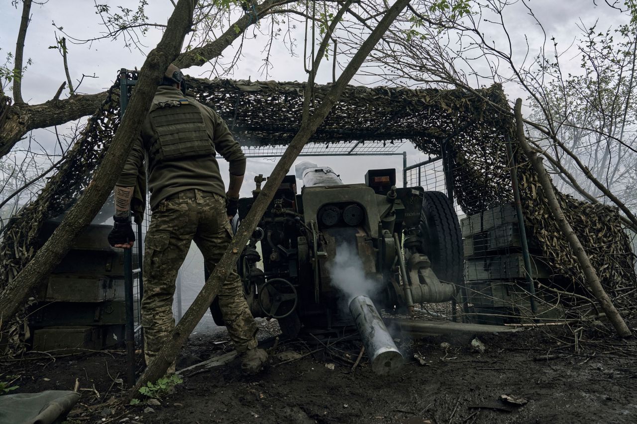 Ukrainian soldiers fire a cannon near Bakhmut, Ukraine, on Saturday.