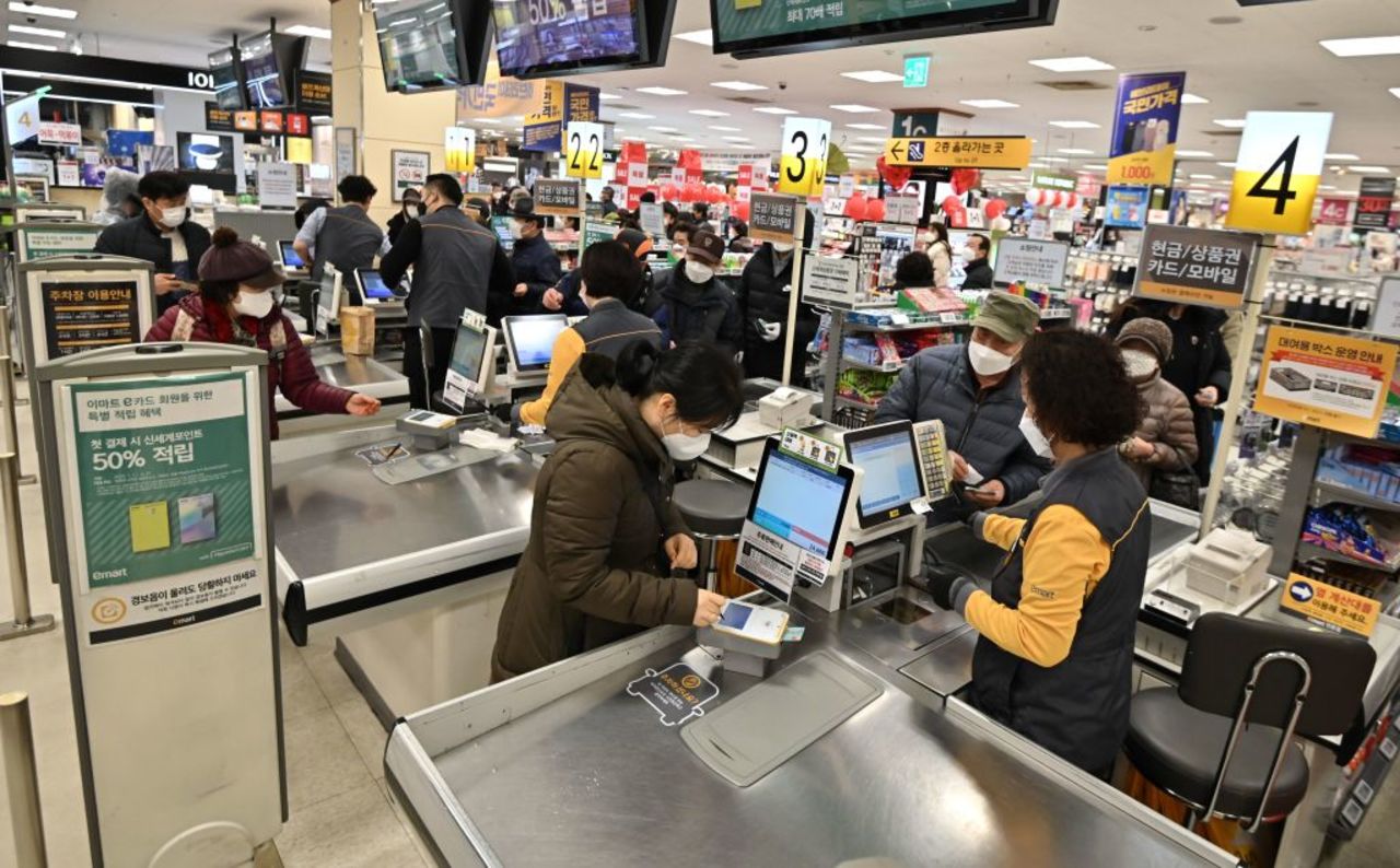 People buy face masks at a retail store in Daegu on February 25.