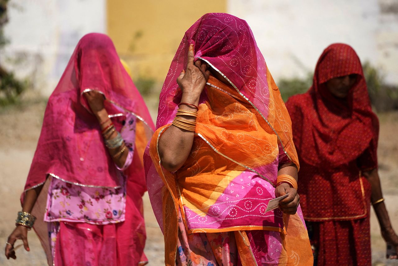 Women leave after casting their votes at a polling station during the second phase of voting of India's general election in Ajmer on April 26.