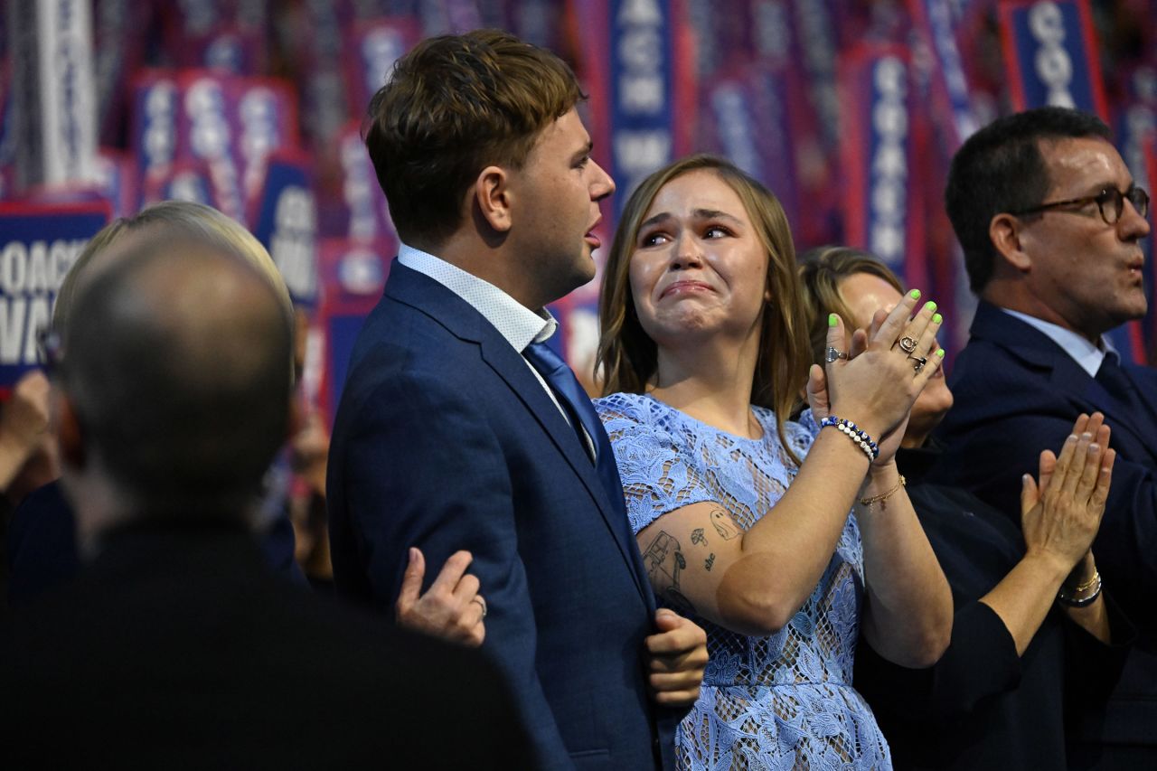 Minnesota Governor and 2024 Democratic vice presidential candidate Tim Walz's son Gus and daughter Hope react as he speaks during the Democratic National Convention on August 21. 