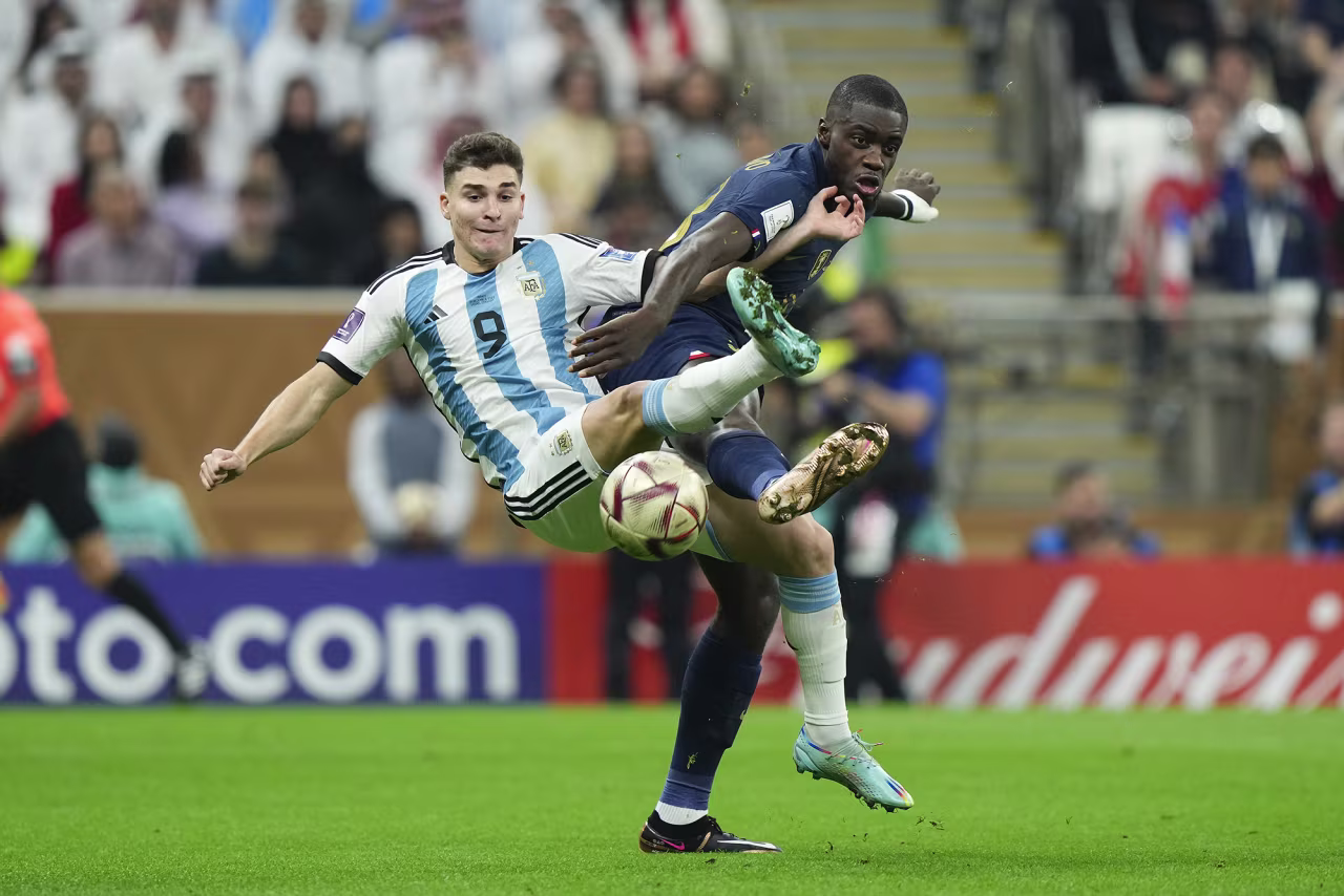 Julian Alvarez, left, and Dayot Upamecano compete for a ball in the second half.