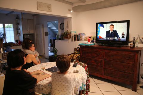 The Larragana family watch French President Emmanuel Macron addressing the nation in Ascain, France, on March 31.
