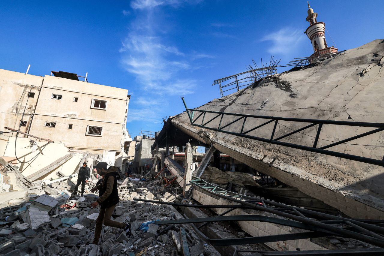 Men walk through the rubble of a mosque that was destroyed during Israeli bombardment in Rafah, Gaza, on February 14.