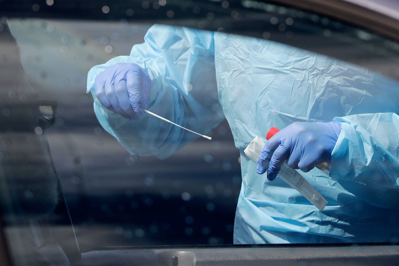 A medical assistant prepares to take a swab from a patient at a coronavirus testing site on April 25, in Seattle, Washington.