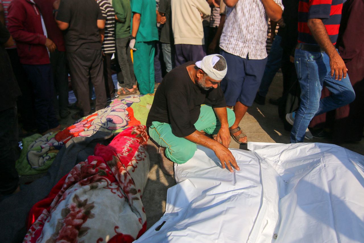 Palestinian mourners gather near the bodies of victims killed in an Israeli attack in Gaza, on June 5. 