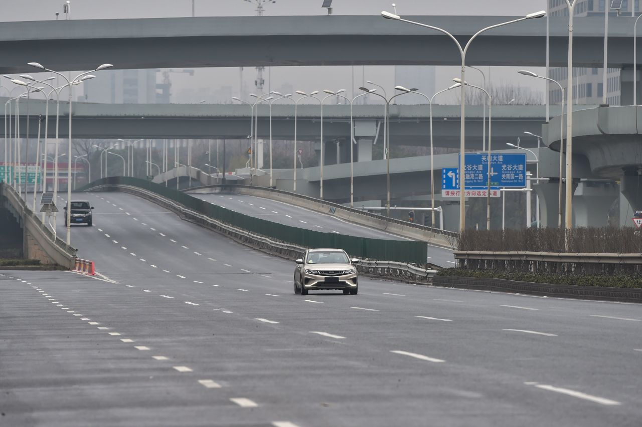 Cars are seen on a road on the first day of the Lunar New Year in Wuhan?on Saturday.