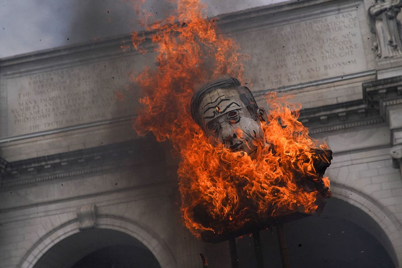 Protesters burn an effigy depicting Israeli Prime Minister Benjamin Netanyahu outside Union Station in Washington, DC, on Wednesday, July 24.