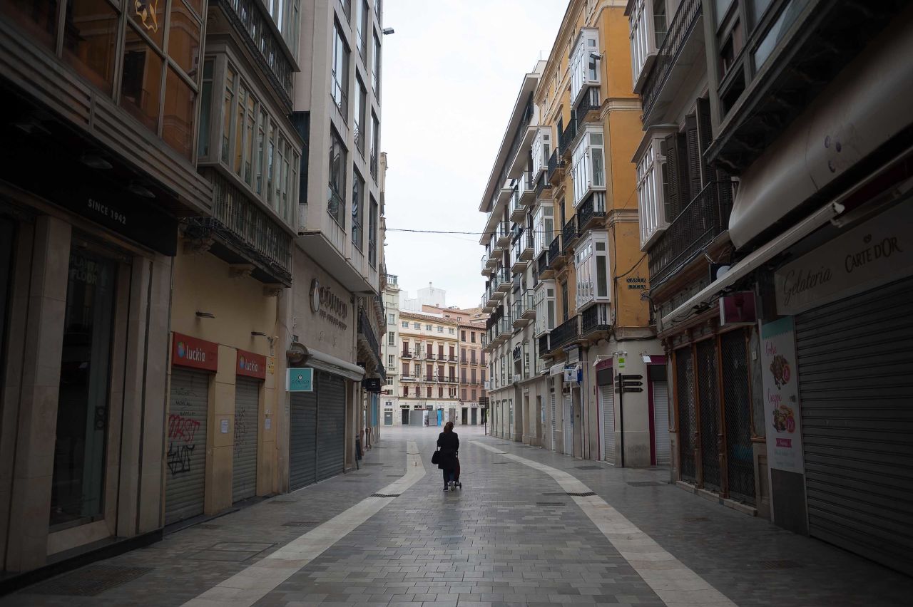 Shuttered businesses are seen on a street in Malaga, Spain, during lockdown on April 4.