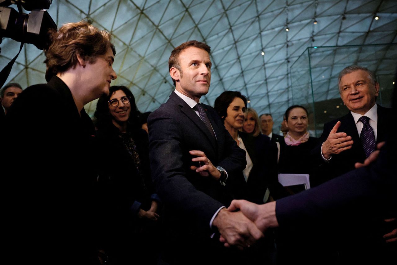 French President Emmanuel Macron and Uzbek President Shavkat Mirziyoyev visit an exhibition at the Louvre Museum in Paris on November 22. 