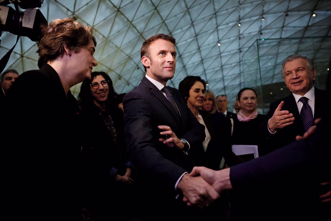 French President Emmanuel Macron and Uzbek President Shavkat Mirziyoyev visit an exhibition at the Louvre Museum in Paris on November 22. 