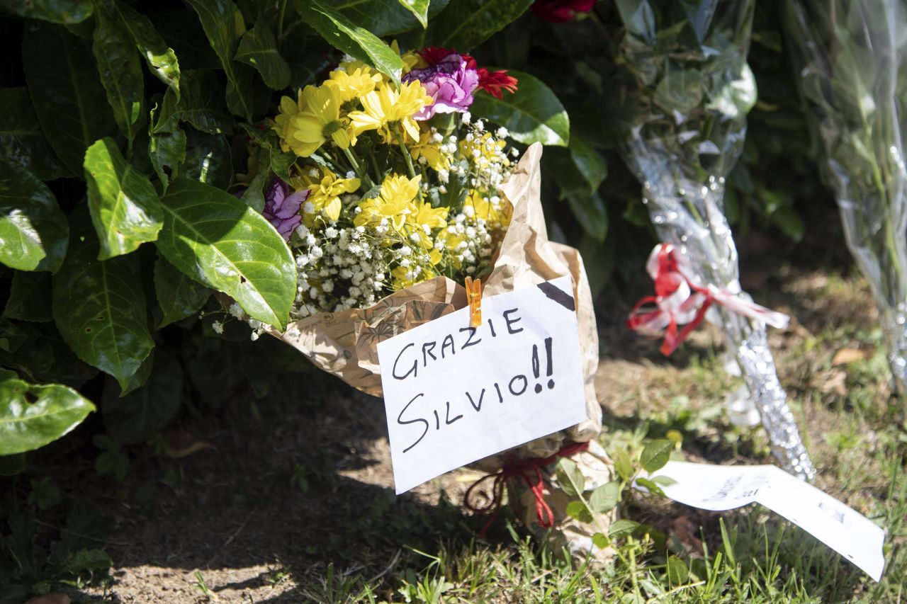 Flower tributes are laid in front of Silvio Berlusconi's residence in Arcore, Italy, on Monday, June 12. 