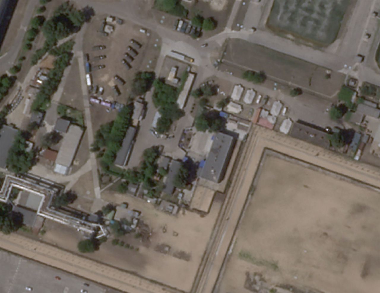 The same area is pictured on July 3 in a satellite image from Planet Labs.