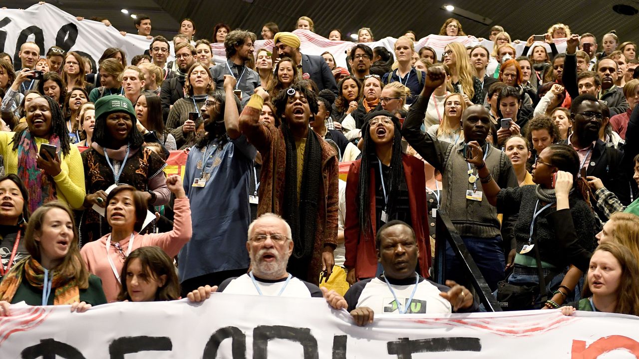 Members of the Global Campaign to Demand Climate Justice protest ahead of the final session of COP24 today.