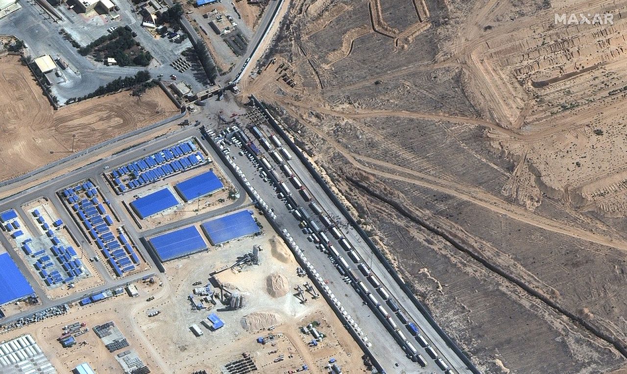 A satellite image shows the convoy of aid trucks waiting on the Egypt side of the Rafah border crossing on Friday.