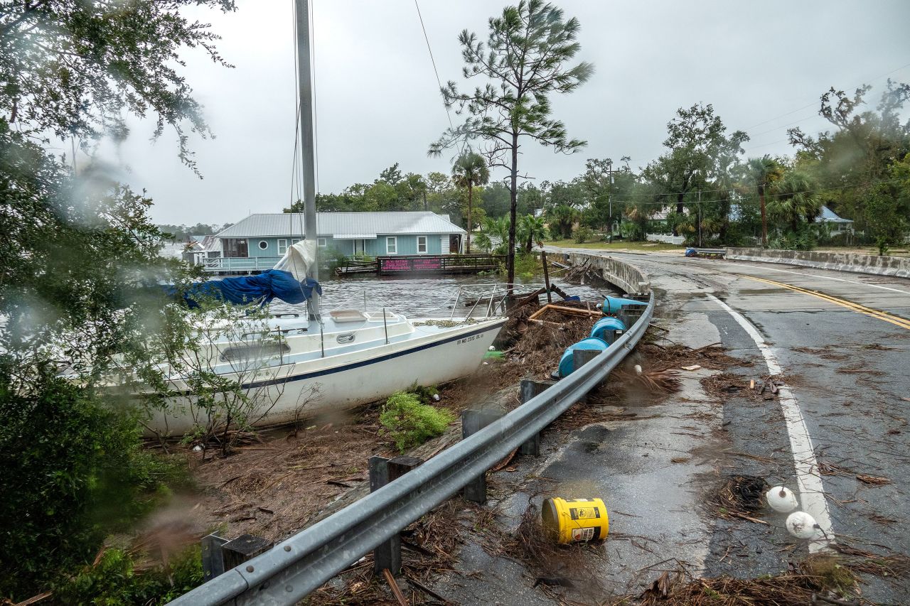 A boat is stranded near a road in Jena, Florida, on Wednesday.