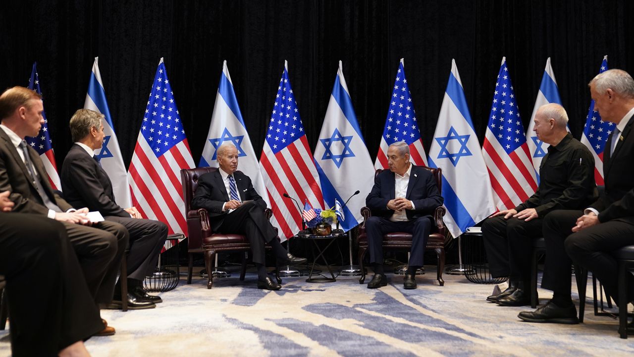 President Joe Biden, center left, and Israeli Prime Minister Benjamin Netanyahu, center right, participate in an expanded bilateral meeting with Israeli and U.S. government officials, on October 18, in Tel Aviv, Israel.