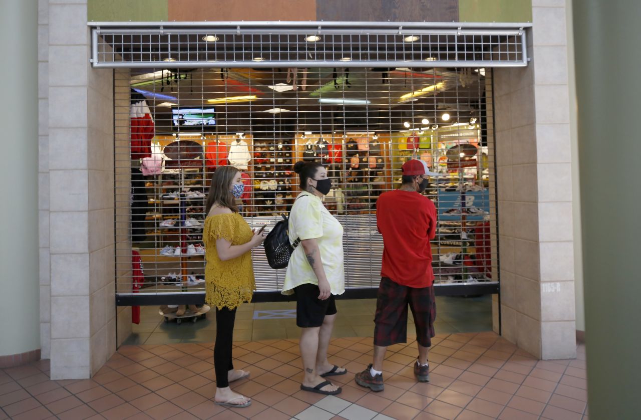 People wait for a Journey's shoe store to open at the Yuba Sutter Mall in Yuba City, California, on May 6.