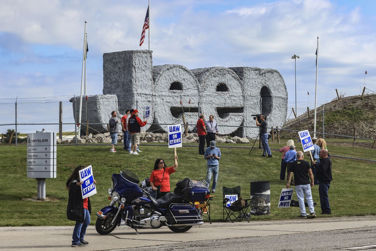 United Auto Workers hold signs while on strike this morning at the Stellantis Toledo Assembly Complex in Toledo, Ohio. 