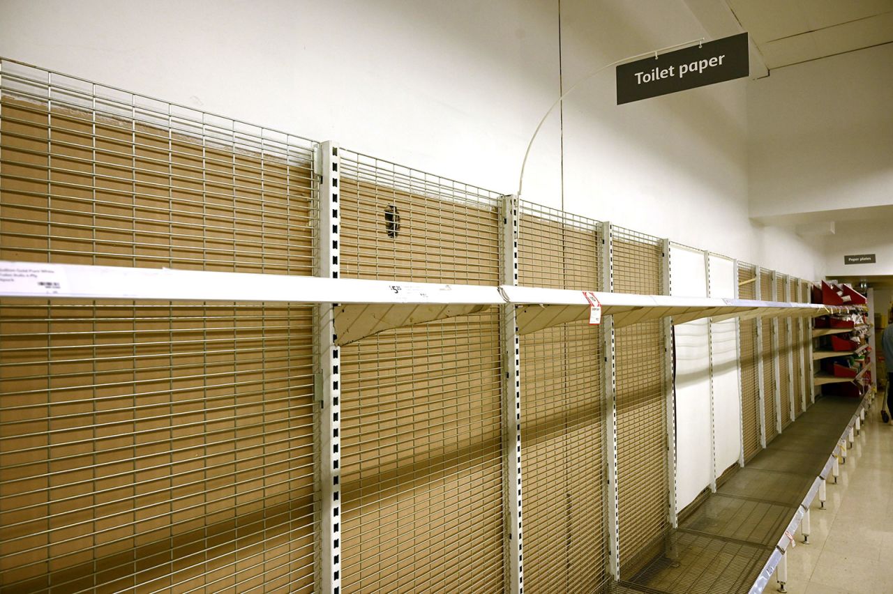 Shelves are empty of toilet rolls in a supermarket in Sydney, Australia on March 4.