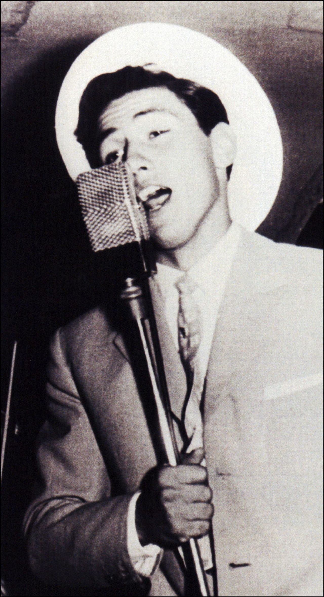 An image from Berlusconi's book "Una storia italiana" shows him during his early singing career. Berlusconi sent copies of the book to Italian voters ahead of the 2001 election.