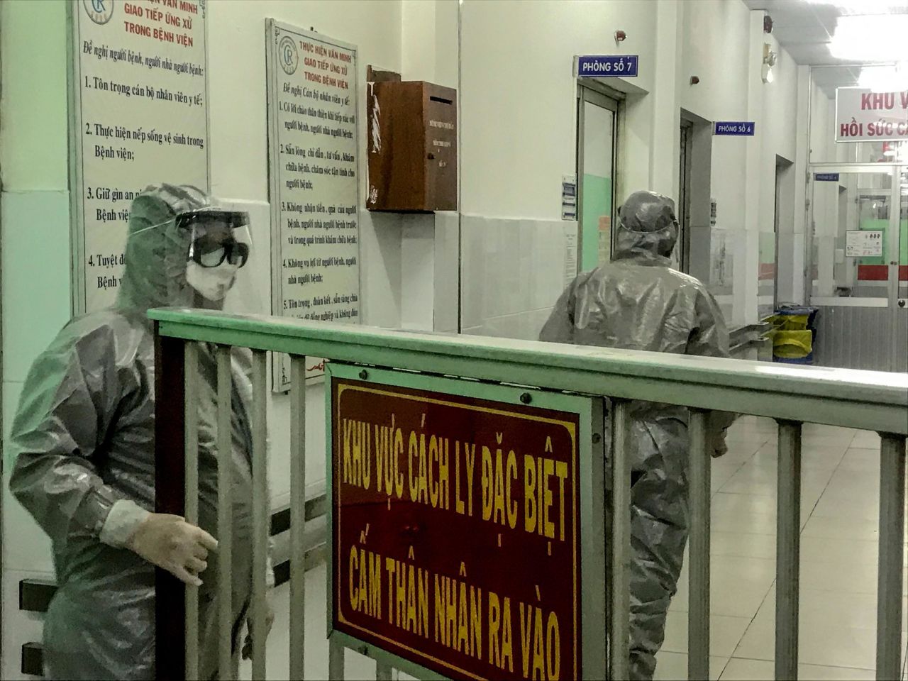 Medical workers enter an isolation area to visit coronavirus patients in Cho Ray hospital in Ho Chi Minh City, Vietnam, on January 23.